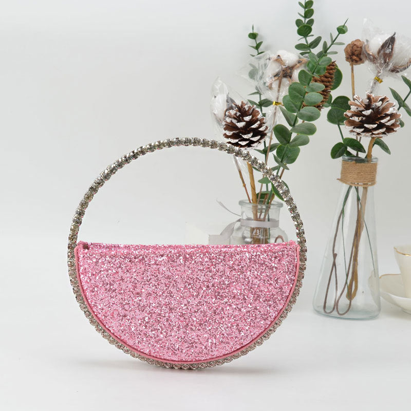 Diamond studded dinner bag with diamond heart-shaped clutch